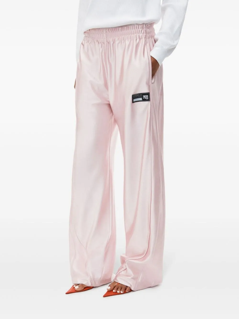 Pantaloni con finitura satinata in rosa Alexander Wang - donna