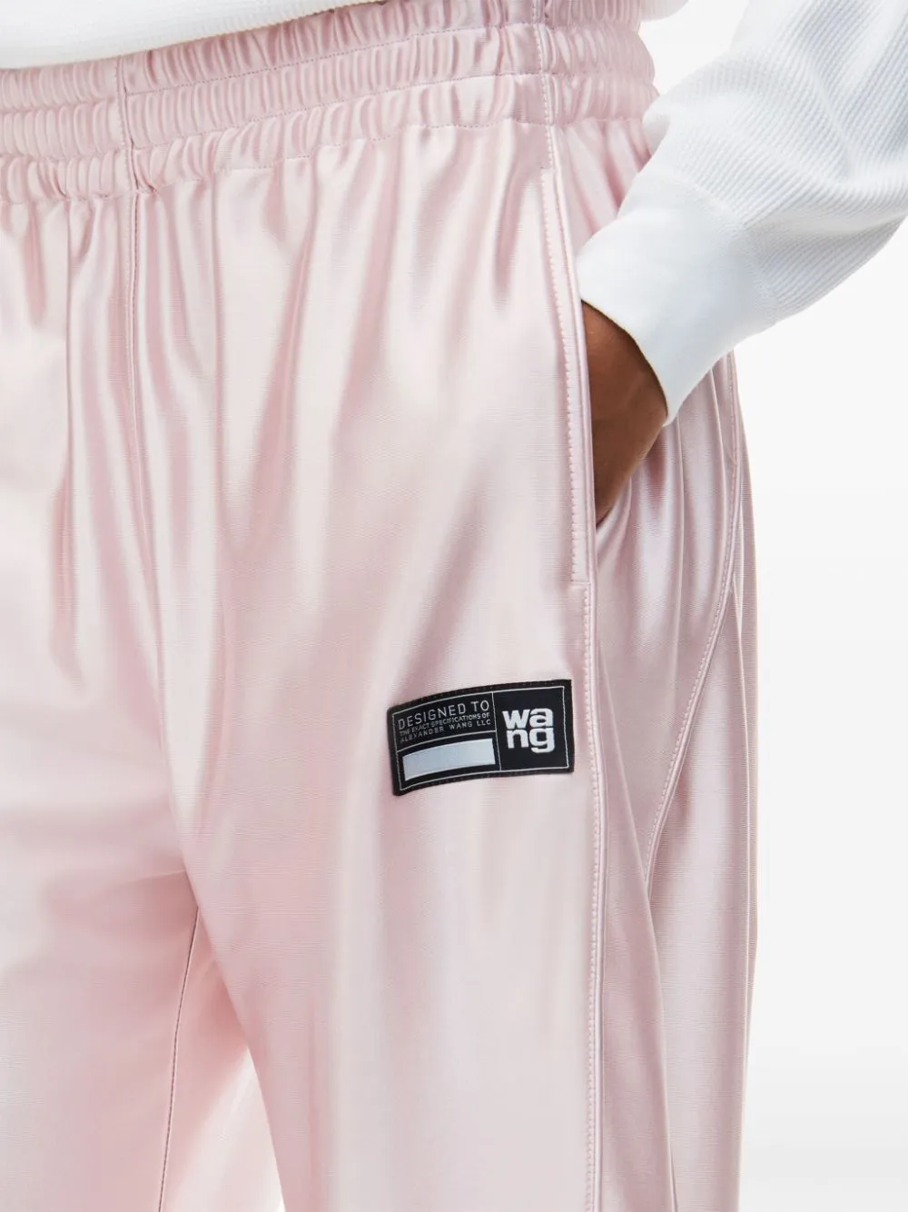Pantaloni con finitura satinata in rosa Alexander Wang - donna